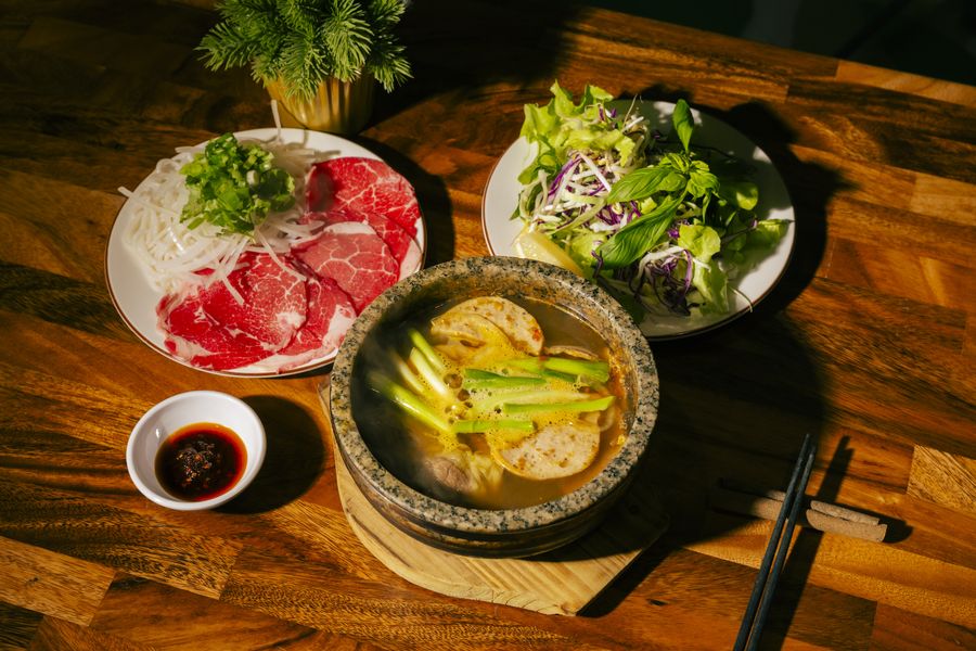 Bún Bò Huế Thố Đá — steaming stone bowl of spicy beef noodle soup