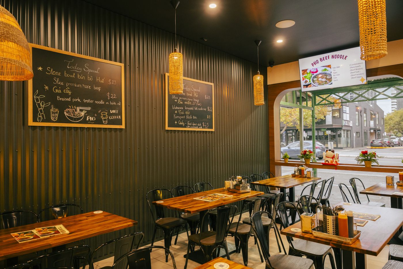 Bà Năm dining room — warm lighting, wooden tables, Vietnamese decor